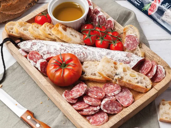 A board of Spanish fuet, chorizo and salchichón