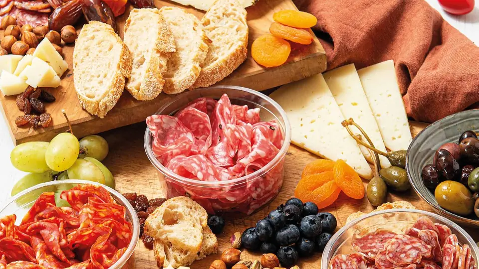 A table of Spanish cured meats, cheese and tapas