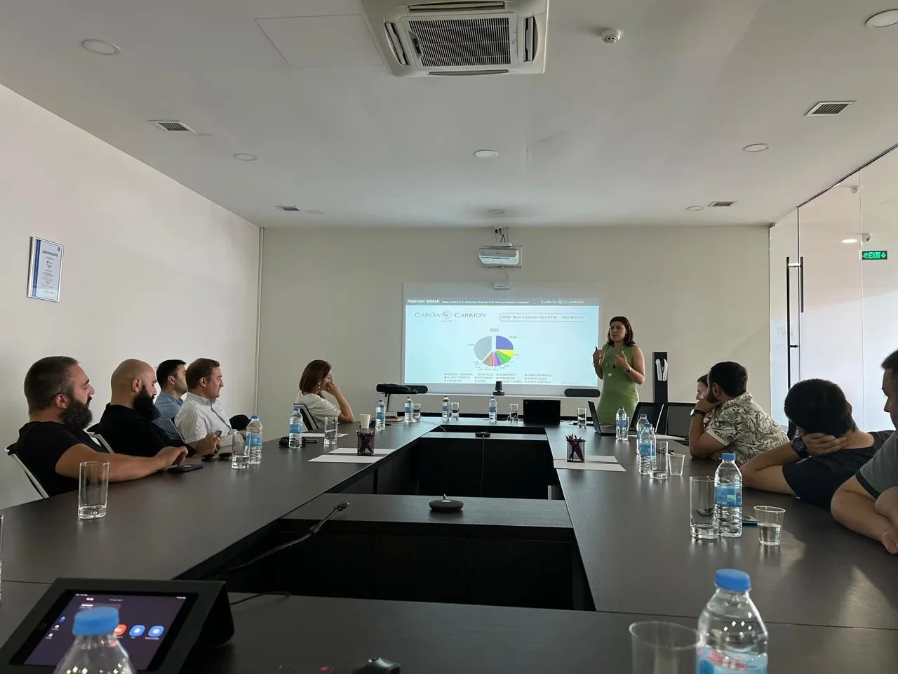 The VLC Trade Group team in a working session with a supplier presentation on screen